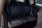 The rear passengers, after cleaning, clean the seats from black expensive fabric in the comfortable cabin of a crossover prepared