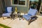 Rear Patio With Small Table & Two Arm Chairs With Blue Cushions