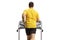 Rear shot of a man running on a treadmill