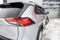 Rear taillight of Toyota RAV4 2018 year in white color after cleaning before sale on parking. Auto service industry