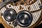 Rear viev of a old pocket watch with an open clockwork on black isolated background. Retro clock, inside view of gearing