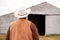 Rear view of an African American cowboy.