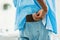 Rear view of african american man keeping wallet in back pocket of his jeans, closeup, cropped