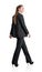 Rear view of attractive full length business woman go walk making step, businesswoman wear elegant black suit. Isolated over white