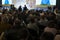 Rear view of Audience listening Speakers on the stage in the conference hall or seminar meeting, business and education about