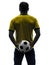 Rear view back man holding soccer football silhouette