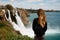 rear view of beautiful woman on background of Duden waterfall in Antalya,Turkey.