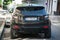 Rear view of black range rover suv car parked in the street