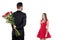 rear view of boyfriend hiding bouquet of roses from girlfriend