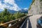 Rear view of brown car driving fast on mountain highway Autoroutes et Tunnel du