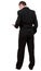 Rear view of business man in black suit talking on mobile phon