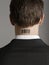 Rear View Of Businessman With Bar Code Tattoo On Neck