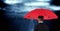 Rear view of businessman holding red umbrella against digital composite image of clouds