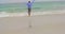 Rear view of Caucasian Businessman running with blazer on the beach 4k