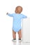 Rear view of caucasian full body one year infant baby boy toddle