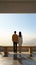 Rear view of a couple gazing at a blank wall together