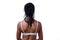 Rear view of dark-skinned woman wearing bra