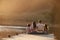 Rear View Of Family Standing On Wooden Jetty By Lake