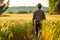 Rear view of farmer walking in a green wheat field. Generative AI