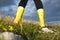 Rear view of female in yellow boots