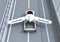 Rear view of futuristic flying car takes off from highway