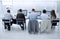 Rear view.a group of call center employees sitting at the Desk.