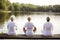 rear view of group of senior women doing yoga exercises on wooden pier in front of summer morning lake, neural network