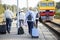 Rear view of a group of seniors elderly people waiting fora train to trave