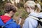 Rear view of hiking couple checking the compass