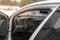 Rear view from inside mirror car, steering wheel, window windshield, windscreen glass covered with frozen ice snow layer, vehicle