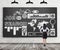 Rear view of a lady in formal clothes who is looking at the huge black chalk board with drawn icons about job search proc