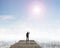 Rear view man standing gazing on wooden bridge