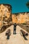 Rear view of man standing between two ancient canons at the entrance of Fort Jesus in Mombasa, Kenya