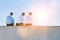 Rear view of mature thoughtful businessmen sitting on office rooftop