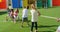 Rear view of mixed-race schoolkids playing tug-of-war in the school playground 4k