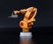 Rear view of orange heavyweight robotic arm on black background