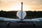 Rear view of a parked small plane on a sunset background. Silhouette of a private airplane landed at dusk.