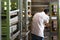 Rear view of pastry chef baking sweet bread with big oven