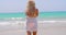 Rear View of a Pensive Blond Woman at the Beach