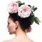 Rear view portrait of the woman with pink flowers in hair