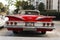 Rear view of a red colored 1960 Chevrolet Impala