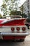 Rear view of a red colored 1960 Chevrolet Impala