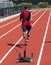 Rear view of runner pulling sled with weights