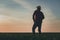 Rear view of satisfied farmer in wheatgrass field