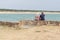 Rear view of senior couple looking atlantic ocean in sea beach in Vendee France