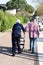 Rear view of senior Mature couple of senior on coast walking on Boardwalk