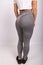 Rear view of sexual sporty sportive tempting beautiful attractive nice round buttocks wearing gray tight pants leggings.