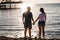 rear view. silhouettes of a man and a woman in sunlight on the beach.