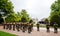 Rear view soldiers from US and France with flags at parade on 8th of may