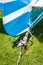 Rear view of tail rudder and wheel of a vintage aircraft parked on a grass field.